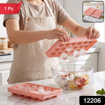 A person in an apron holds a pink ice ball tray, releasing clear ice balls into a glass bowl of fruit, with a '1 Pc' label.