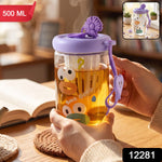 A glass tea sipper cup with a purple lid and cartoon duck face design is held, with a "500 ML" label in the top left and a