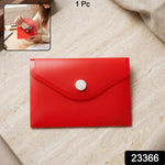 A red plastic document folder envelope with a white button closure is displayed on a light marble surface, with text