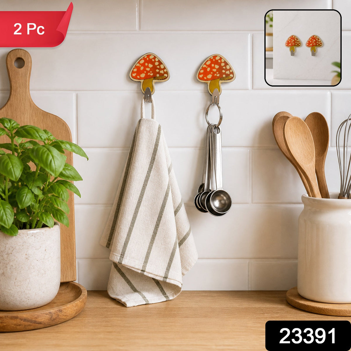 Two mushroom-shaped adhesive hooks are displayed on a white tiled kitchen wall, with a '2 Pc' label in the corner.