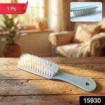 Close-up of multipurpose handheld cleaning brush bristles and ergonomic handle