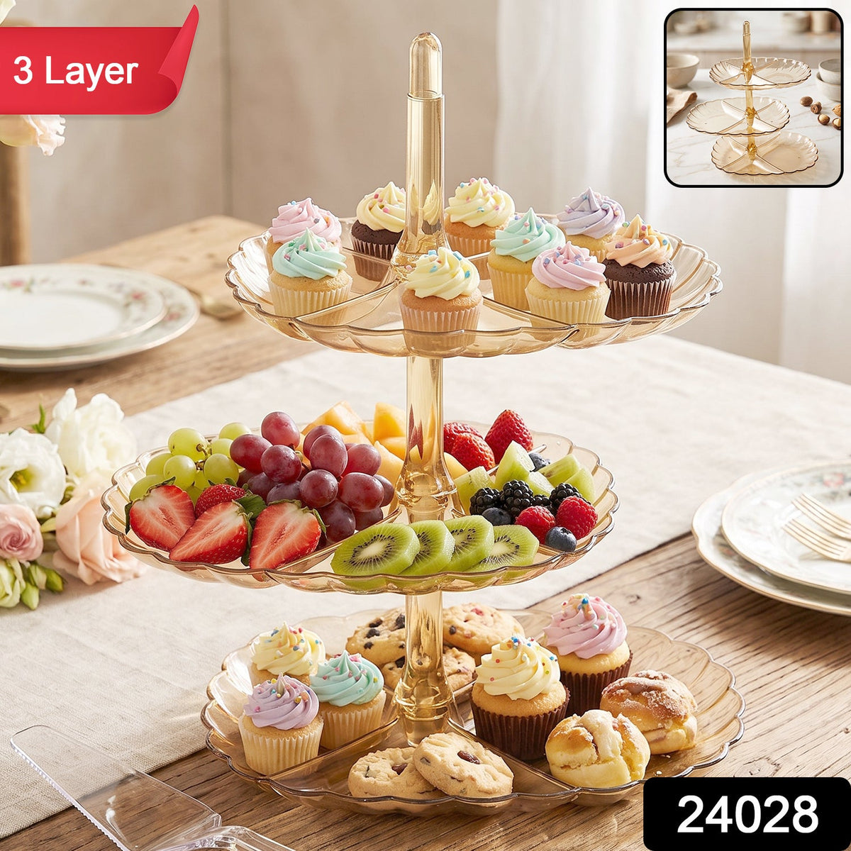 A three-layer amber acrylic dessert stand displays various treats, fruit, and baked goods on a dining table.