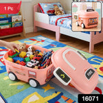 Pink fire truck toy storage box filled with colorful toys in a child's bedroom