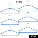 Close-up of a sturdy plastic clothes hanger, showcasing its robust design.