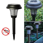 Garden Vera solar mosquito trap and garden light illuminating an outdoor space.