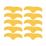 Ten gold, curved forehead patches are arranged neatly on a white background.