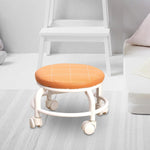 Side view of the portable rolling stool highlighting its sturdy wheels.
