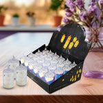 A black display box holds twenty-four unlit LED tea lights, with three loose lights beside it.