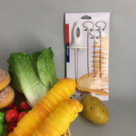 Side view of the manual potato spiral cutter on a white surface.