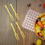 Plastic fruit forks arranged for party use