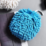 Hands drying quickly with a soft microfiber chenille hand towel.