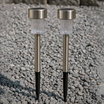 Weatherproof solar path light standing in a garden with green foliage