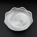 An empty round plastic tray showcasing its traditional design.