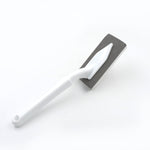 Multi-surface triangle cleaning tool for various household chores.