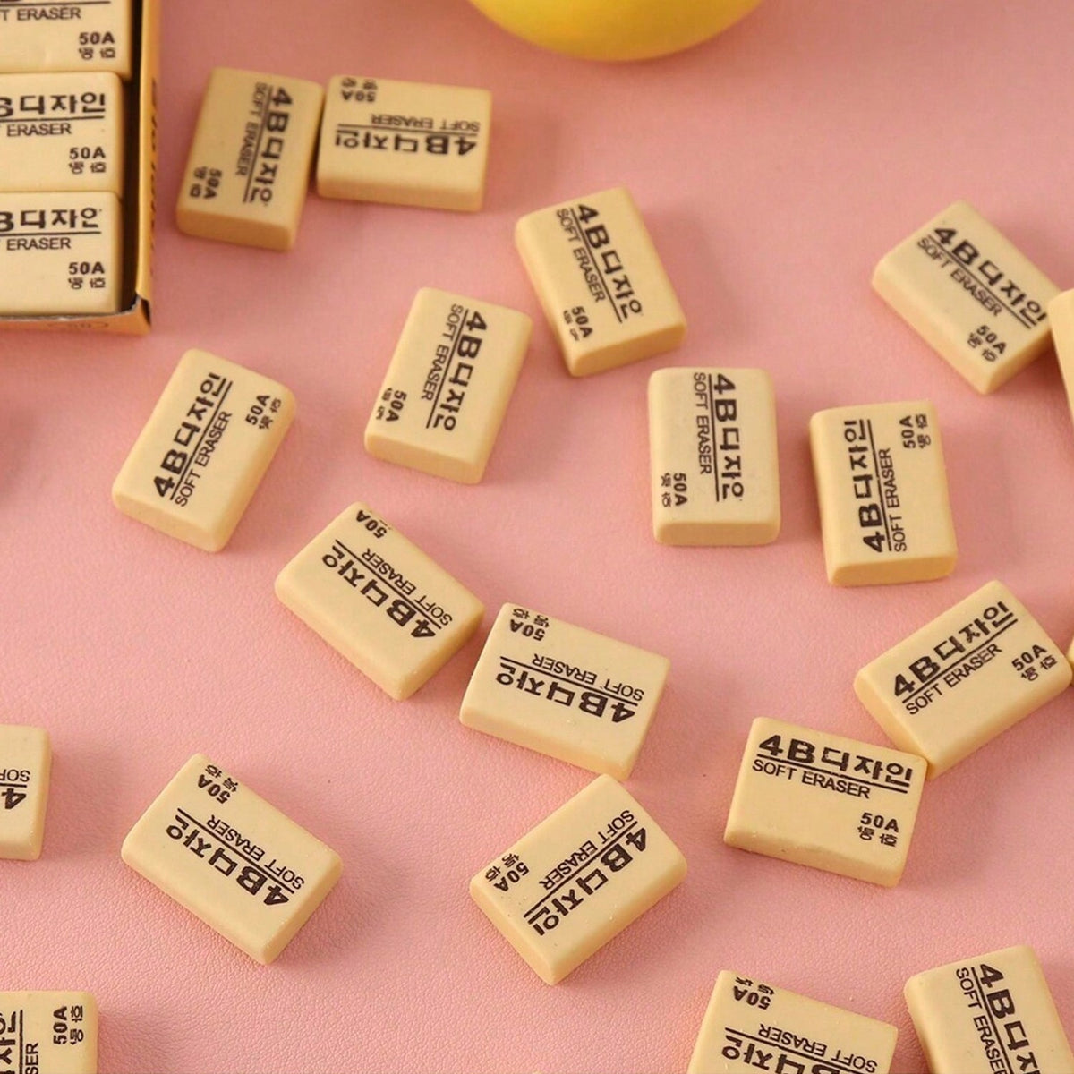 A rectangular bright yellow 4B eraser ready for school or office tasks.