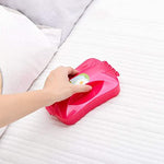 Ergonomic handheld roller brush effectively gathers crumbs and debris from carpets.