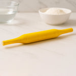Hands skillfully using the Bombay belan to flatten dough for perfect rotis.