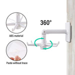 Close-up of the wide self-adhesive wall hook securely holding kitchen utensils.