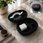 An open black oval hard shell case displays a coiled white cable in a mesh pocket and a white adapter in a molded