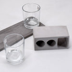 Elegant wine glass holder set with two glasses on a marble base, ideal for home decor.