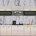 A modern kitchen with white and grey marble pattern self-adhesive wallpaper applied to the backsplash.