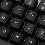 Angled view of the wired keyboard, highlighting its full-size layout and ergonomic key placement.