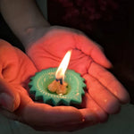 A pair of decorative silicone diyas emitting a soft glow, perfect for creating a spiritual atmosphere.