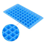 Ice cubes freshly removed from the 60-Cavity Ice Tray, ready for a chilled beverage.