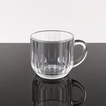Transparent plastic tea cup filled with hot beverage, lightweight design