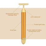Portable gold vibrating face massager for on-the-go beauty.
