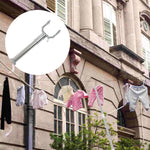 Stainless steel telescopic clothes hook with a robust grip handle.