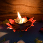 Side view of brass oil diya lotus shaped for pooja rituals