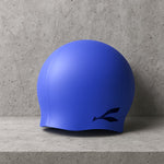 Silicone swimming cap stretching smoothly over a swimmer’s head to show its anti-slip fit