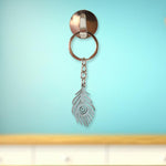 Elegant laser-cut peacock feather keychain accessory