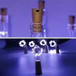 A glowing wine bottle cork string light with multi-color LEDs, perfect for festive decor.