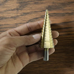 Detailed look at the sharp edges and titanium coating of the HSS steel step drill bits.