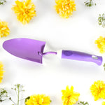 Weeder tool effectively removing unwanted plants from garden beds.