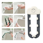 A white cloud-shaped holder with dark grey rain-like arms and white raindrop hooks. A grid of small images shows the holder