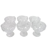 Variety of desserts like parfaits and sundaes beautifully presented in glass serving cups.