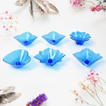 The elegant plastic candle holders from the Diwali Diya Set displayed on a surface.
