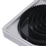 Multiple carbon steel hole saws of different diameters, highlighting the range available in the kit.