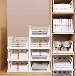 Compact stackable storage organizer with smooth-rolling casters.