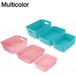 Durable plastic shelf storage baskets for organizing pantry items.