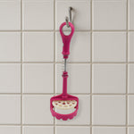 Easy-to-clean food-grade potato masher under running water.