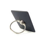 A black square phone ring stand with a silver ring, viewed from an angle, on a white background.