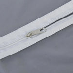 Closeup of durable full-length zipper on the breathable fabric suit cover.