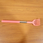 Khujli Stick back scratcher with its product packaging and included accessories.