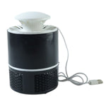 Unplugged mosquito trap device on table demonstrating compact design
