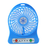 Compact rechargeable mini table fan placed on a desk for workspace cooling