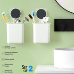 Drill-free adhesive bathroom organizer cups installed on a wall